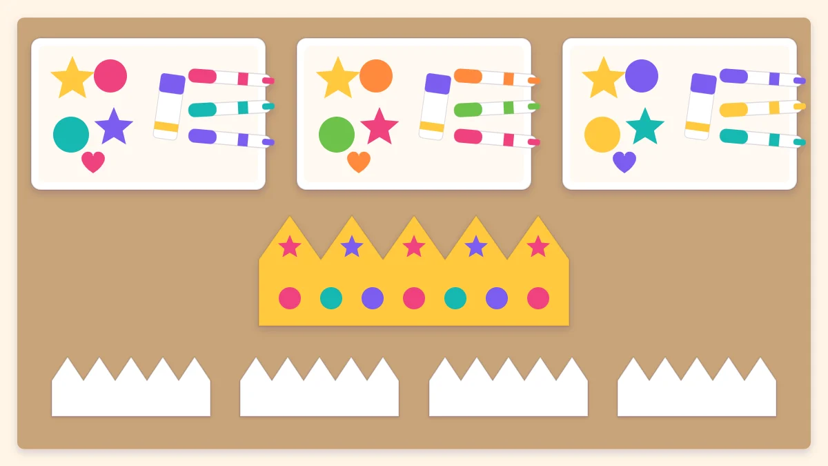 A craft table seen from above with supply trays, blank paper crowns and one finished sample crown in the center