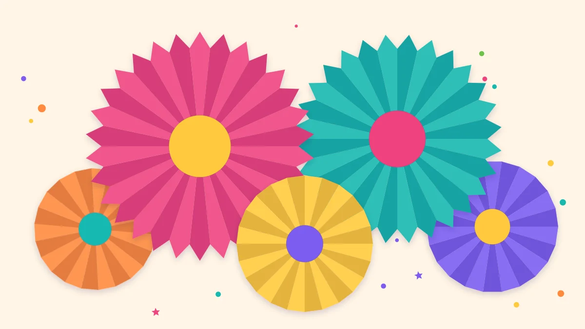 Five accordion-folded paper rosettes in bright colors and different sizes clustered on a wall