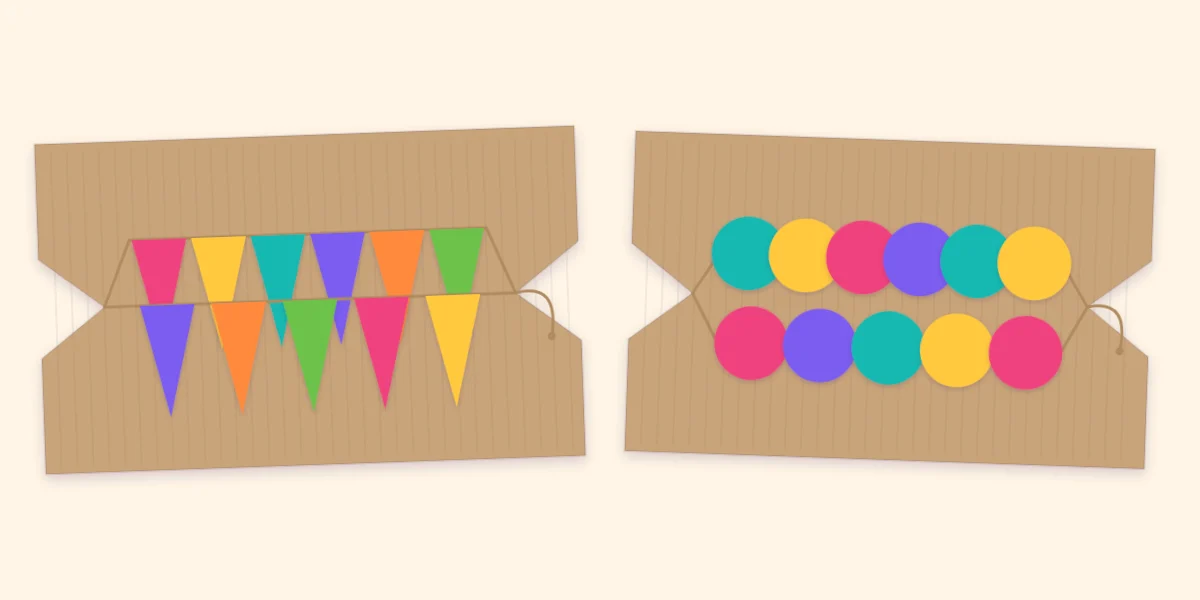 A pennant banner and a circle garland each wound around a notched piece of cardboard for storage
